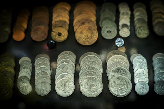 A diverse array of antique coins displayed in Bandung, showcasing historical currency from Indonesia.