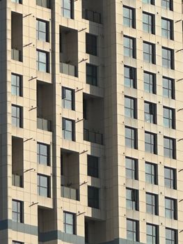 Close-up of a modern high-rise building facade with geometric patterns.