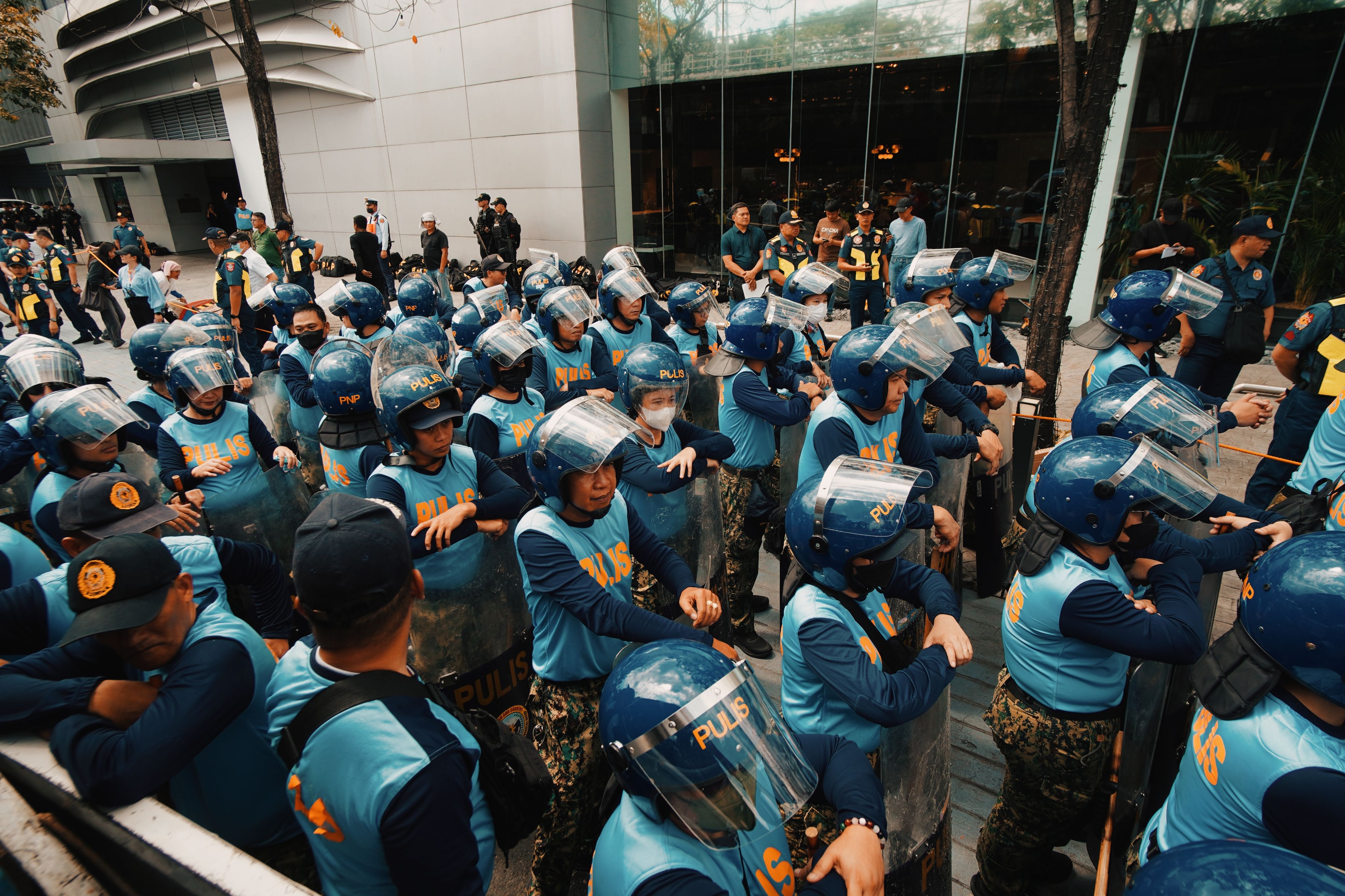 A large group of police officers in riot gear gathered in the city.