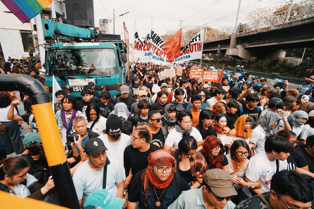 Crowded Street Protest with Colorful Banners · Free Stock Photo
