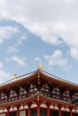Traditional Japanese Temple Roof with Blue Sky