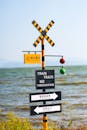 Scenic Train Track Warning Sign by Waterfront