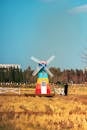 Colorful Windmill in Autumn Field