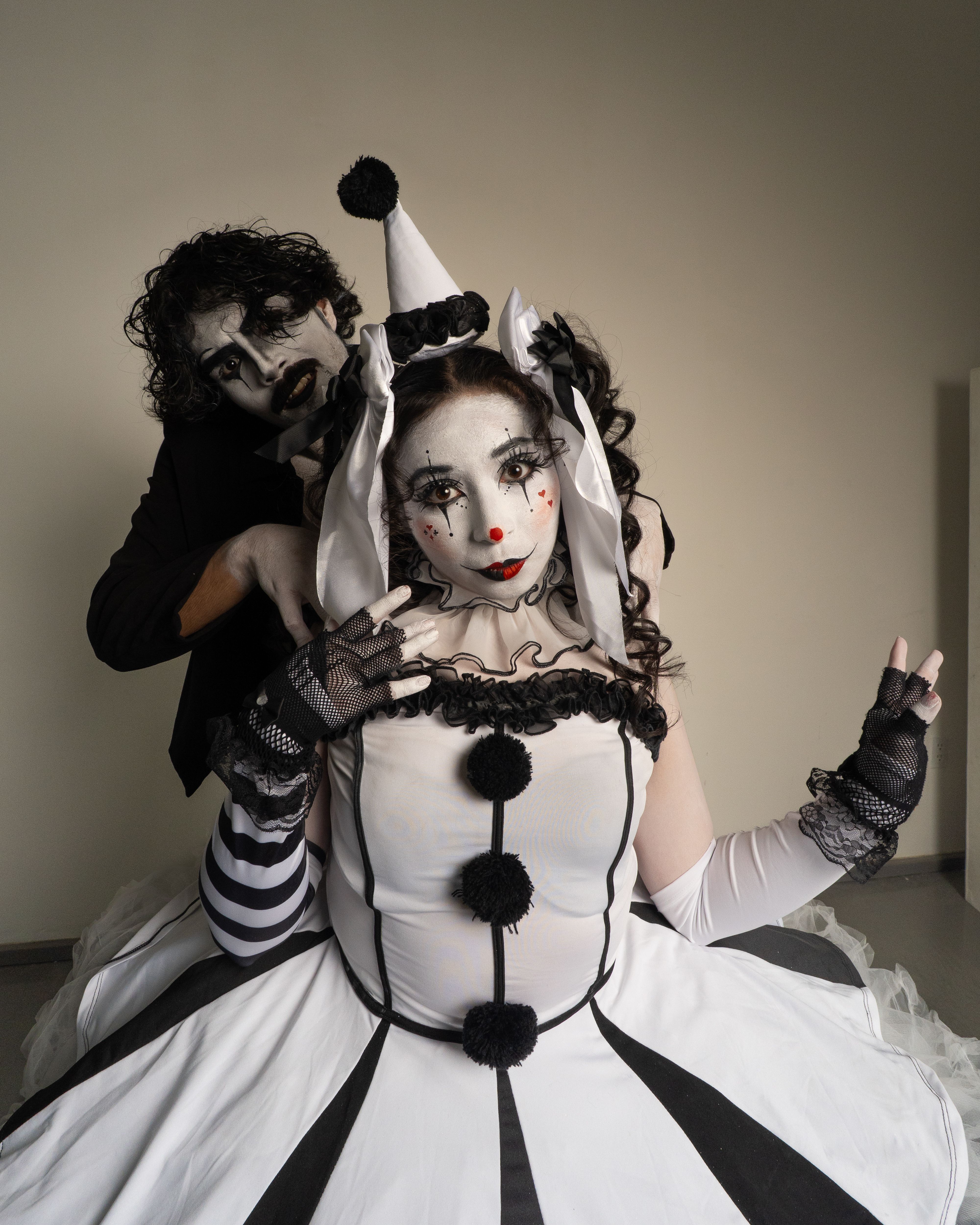 Black and White Photo of a Man in a Clown Costume  Free Stock Photo