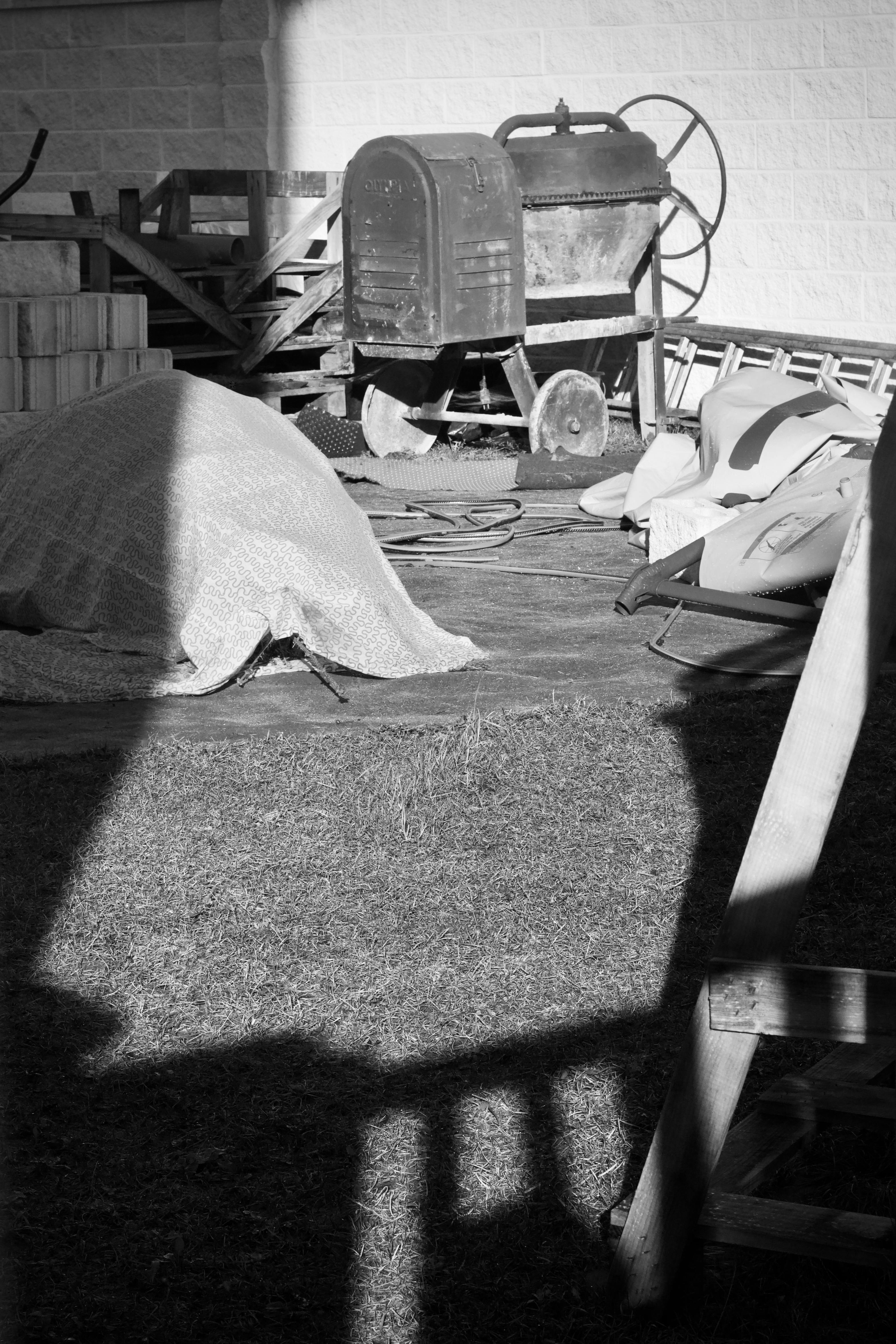 Free Black and white photo of vintage farm equipment creating a nostalgic rural scene. Stock Photo