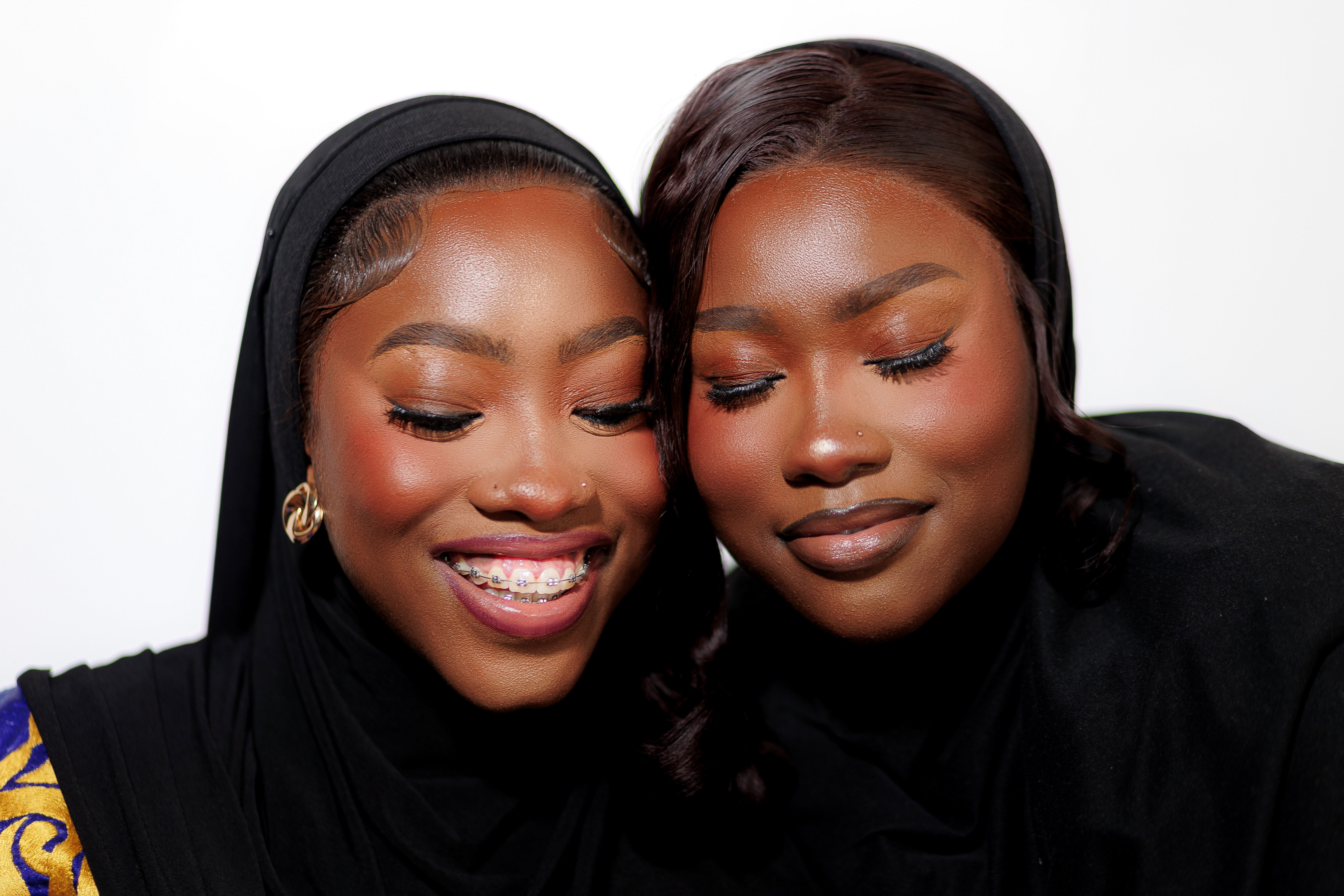 Portrait of Two Smiling Women in Traditional Attire · Free Stock Photo