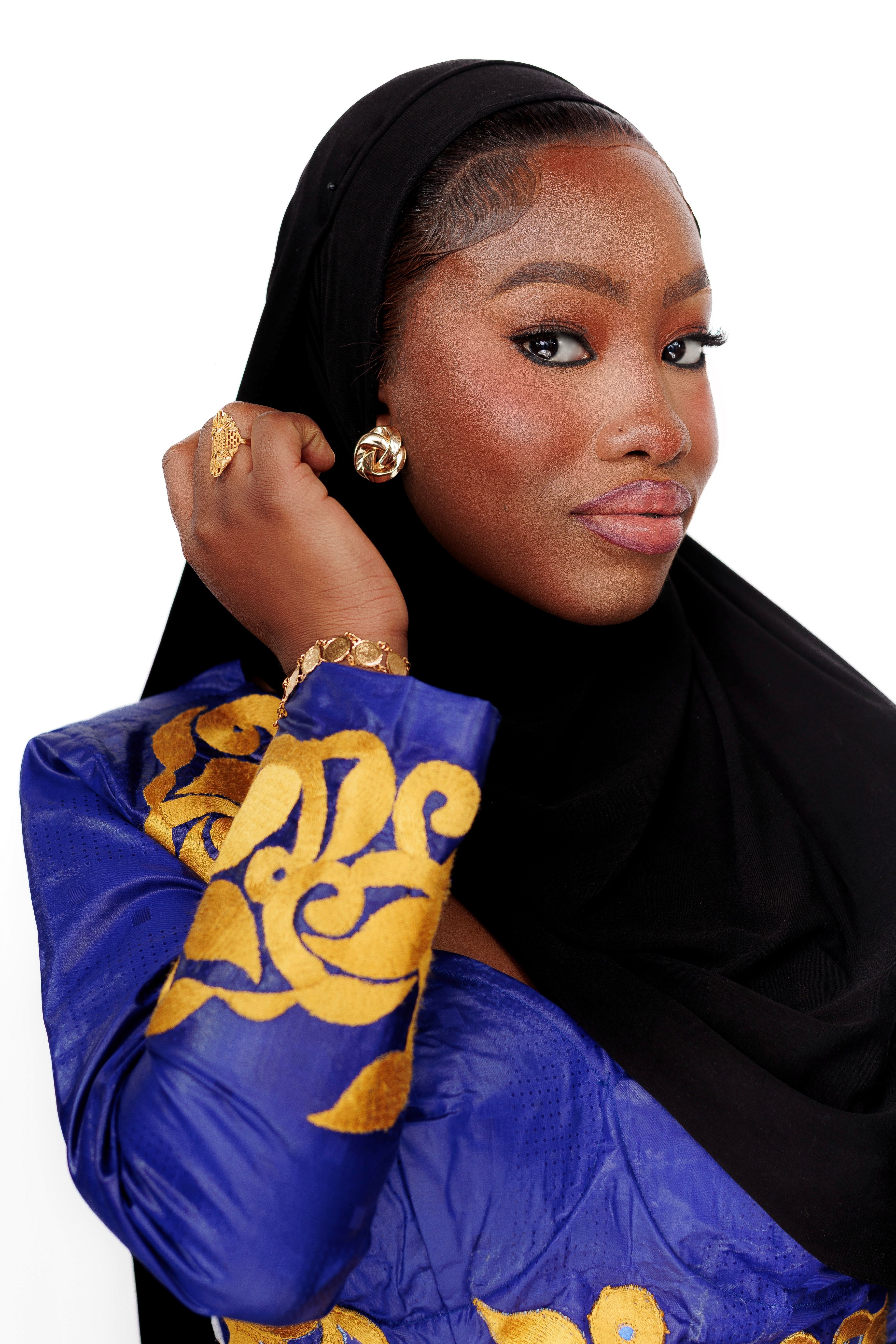 Elegant Woman in Traditional Attire with Hijab · Free Stock Photo
