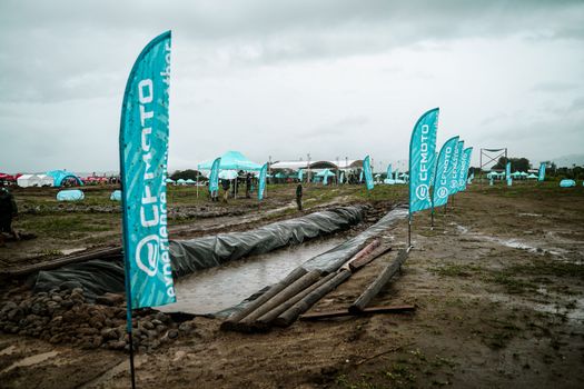 Rainy day outdoor event with CFMOTO branding in Bulakan, Central Luzon.
