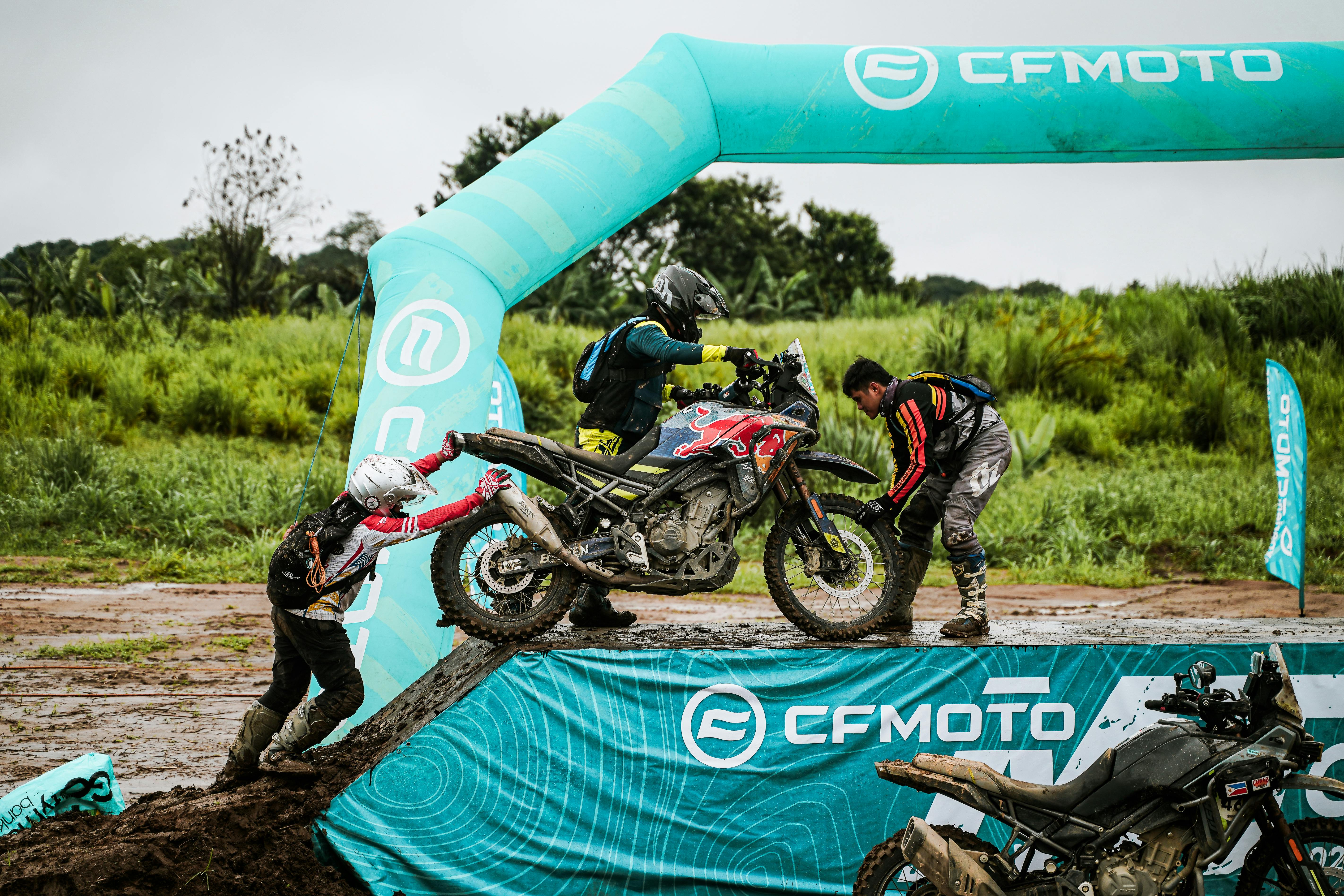 Riders tackle a challenging off-road track at a motorcycle event in Bulakan, Philippines.
