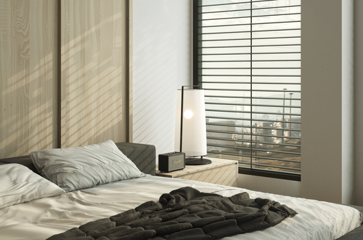 A modern bedroom interior with soft lighting and a window view, featuring wooden accents and minimalistic design.