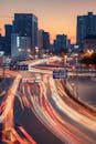 Vibrant City Intersection at Dusk with Light Trails