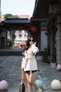 Fashionable Woman in Urban Setting with Trench Coat