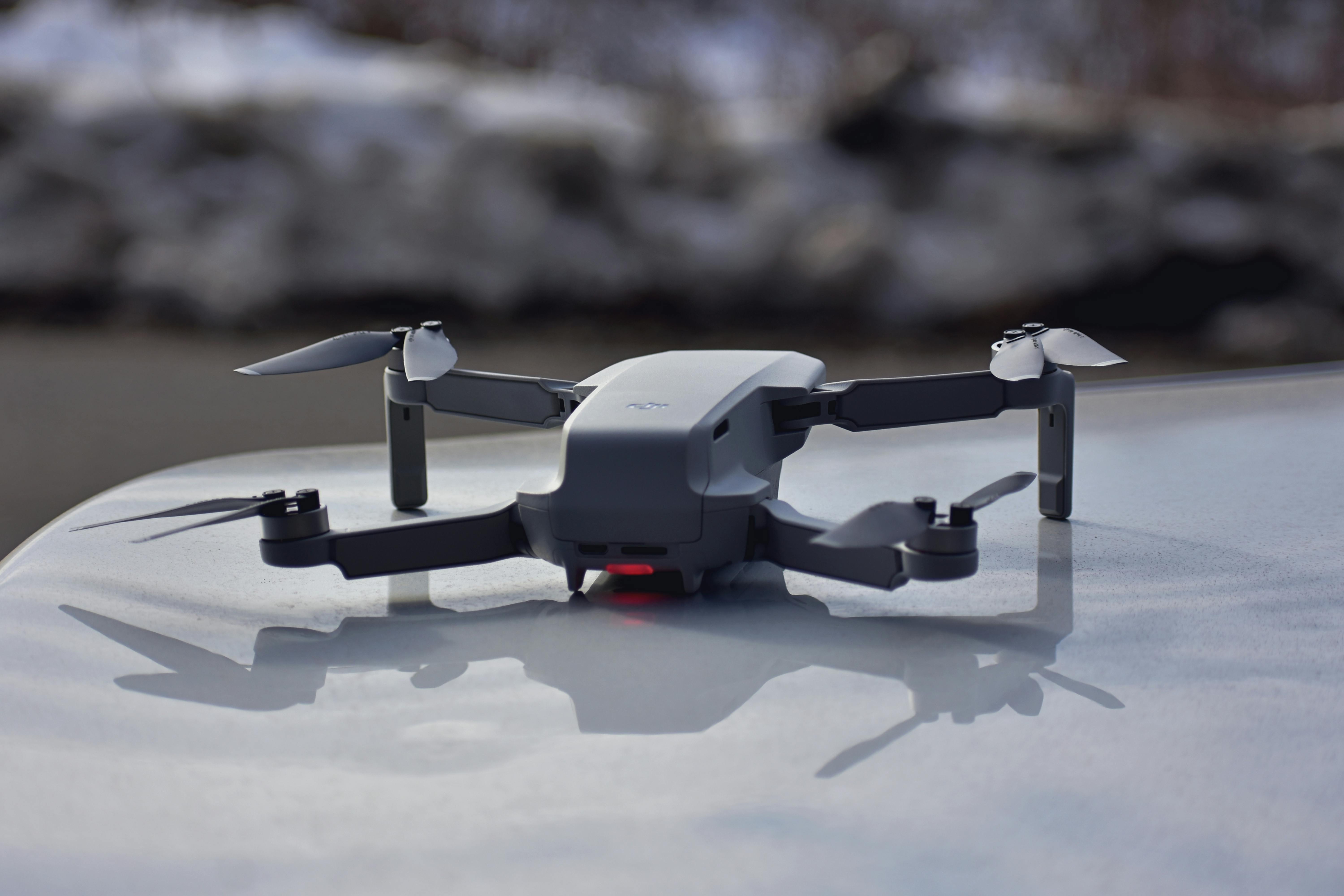 gray and black quadcopter drone