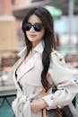 Chic Woman in Trench Coat with Sunglasses Outdoors