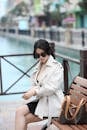 Stylish Woman in Trench Coat by Canal