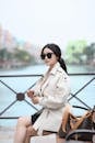 Stylish Woman in Sunglasses by Scenic Canal