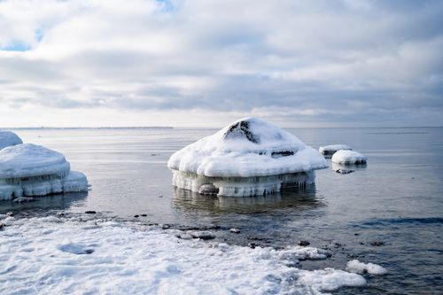 Free Frozen rocks on Estonia's Baltic coast during a crisp winter day, showcasing natural winter beauty. Stock Photo