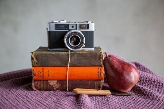 Free stock photo of analog camera, antique books, artistic still life