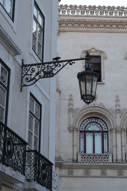 Free A vintage street lamp against the backdrop of ornate Lisbon architecture. Stock Photo