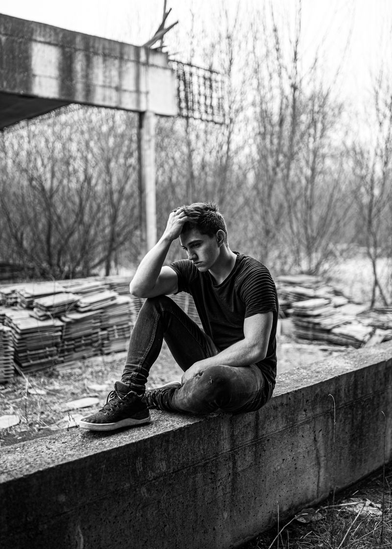 Unhappy man sitting alone