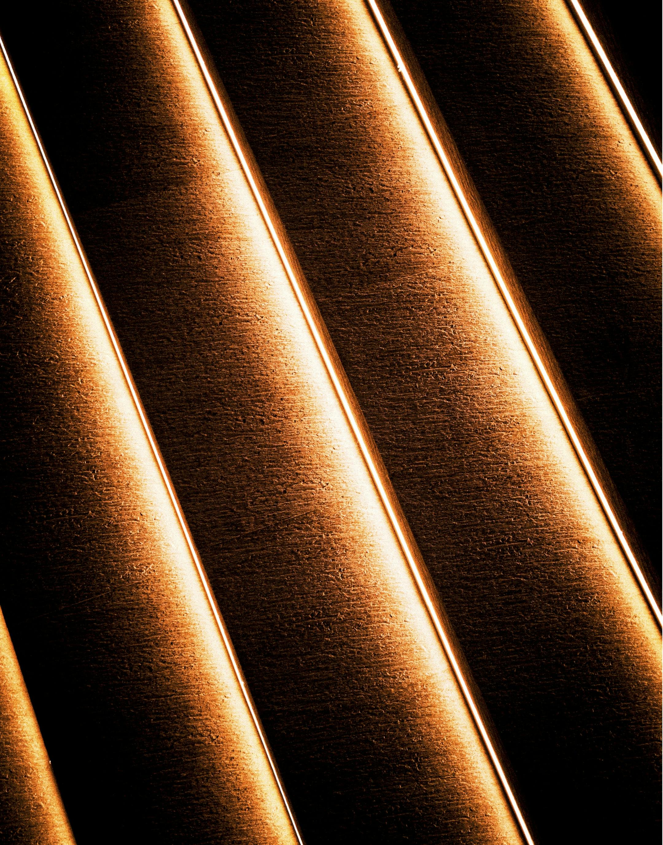 Free Artistic abstract pattern of diagonal lines with warm lighting creating shadow effects. Stock Photo