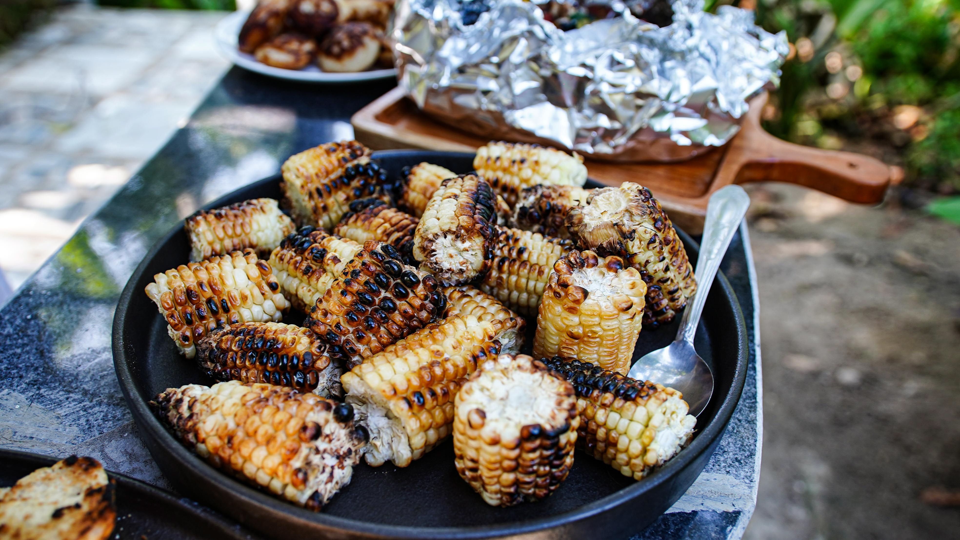 Grilled corn and vegetables with smoky char marks
