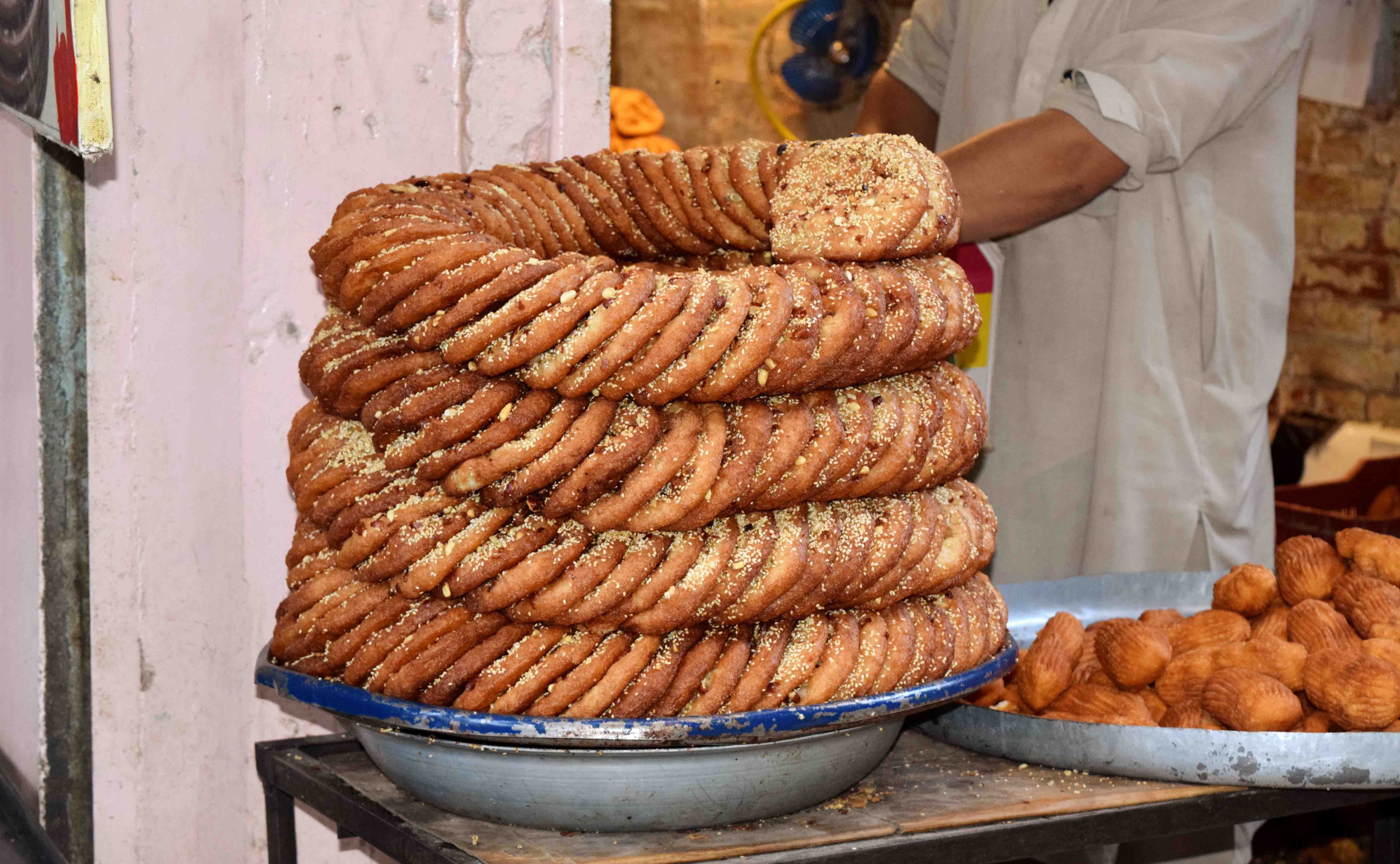 A large stack of traditional pastries from Swat, Pakistan, showcasing unique local cuisine.