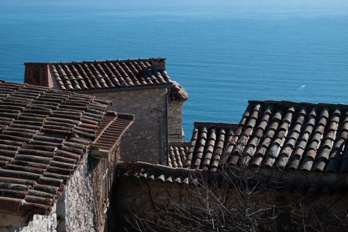 Free Charming terracotta rooftops with a stunning view of the Monaco coastline under bright daylight. Stock Photo