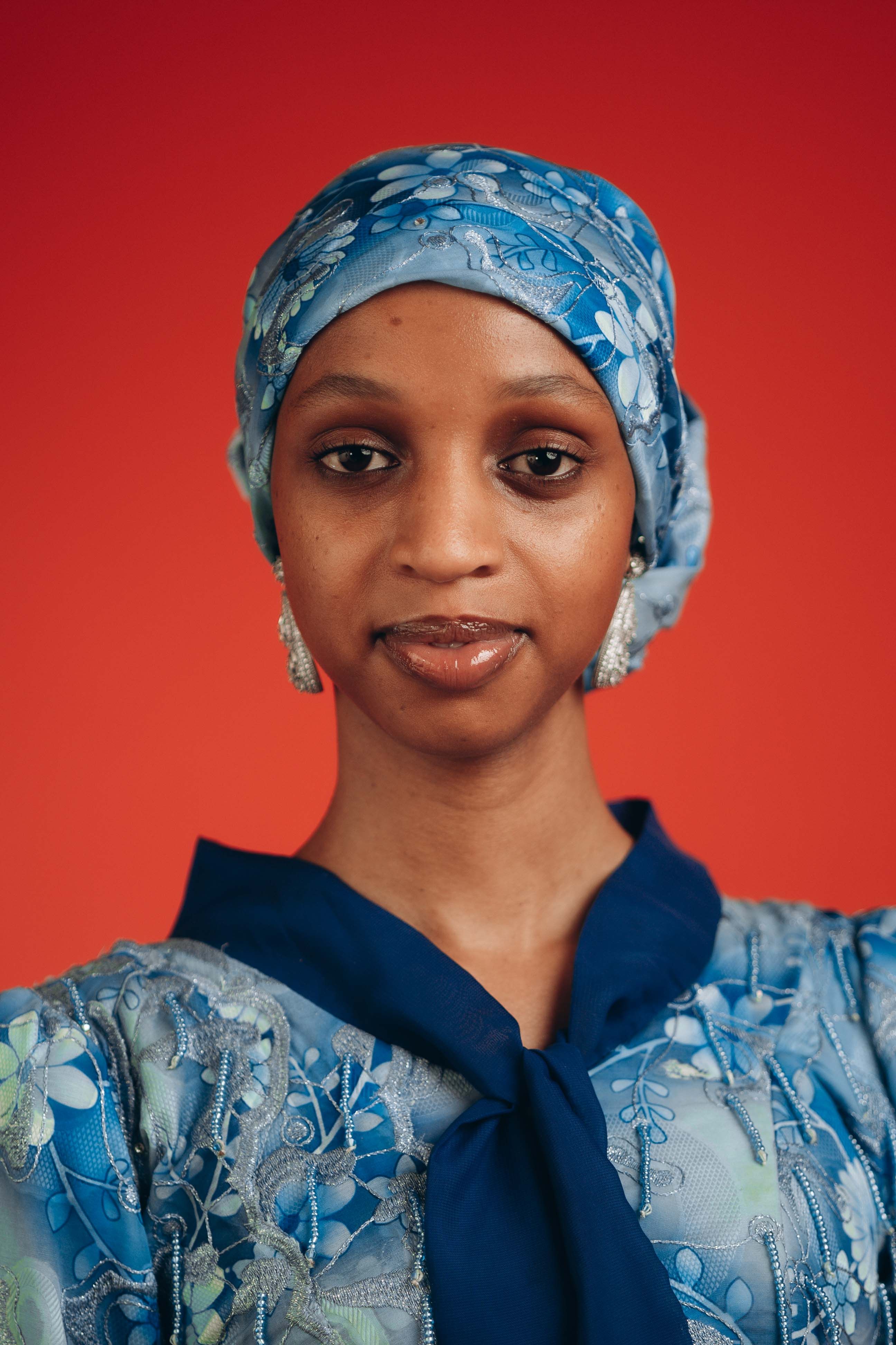 Elegant Woman in Blue Headscarf and Dress · Free Stock Photo