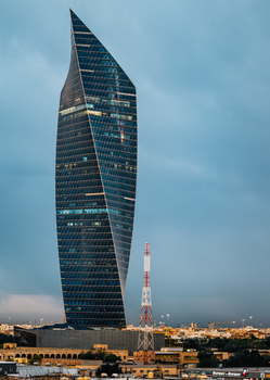 Stunning view of Al Hamra Tower against a dramatic sky in Kuwait City.