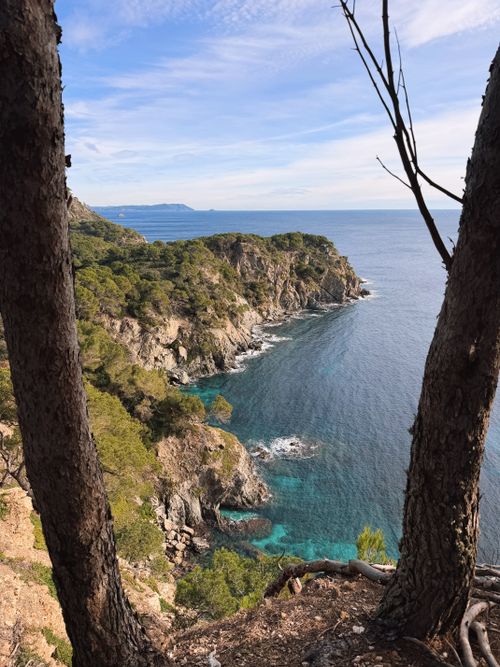 Free Explore a picturesque coastal cliff and vivid blue sea under a clear sky. Stock Photo