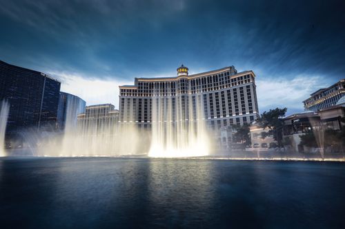 Free Capturing the breathtaking Bellagio Fountain against the iconic Las Vegas skyline at twilight. Stock Photo