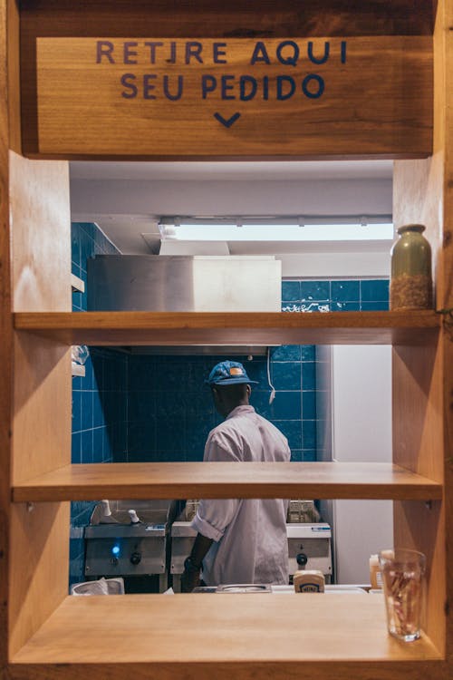 Free Man Standing in The Kitchen Stock Photo