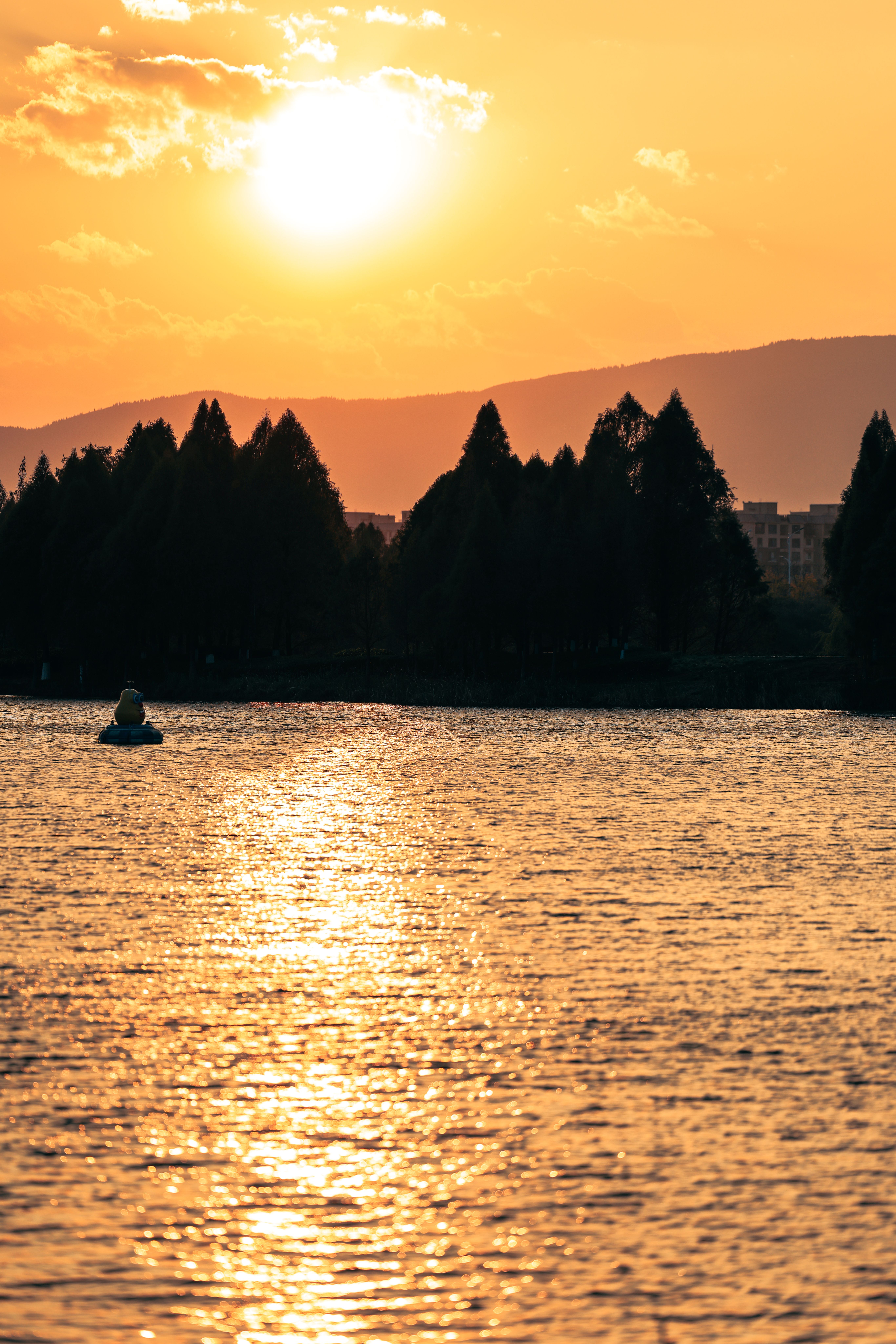 Serene Sunset Over Tranquil Lake Waters · Free Stock Photo