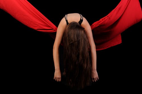 Woman in Black Brassiere and Red Textile