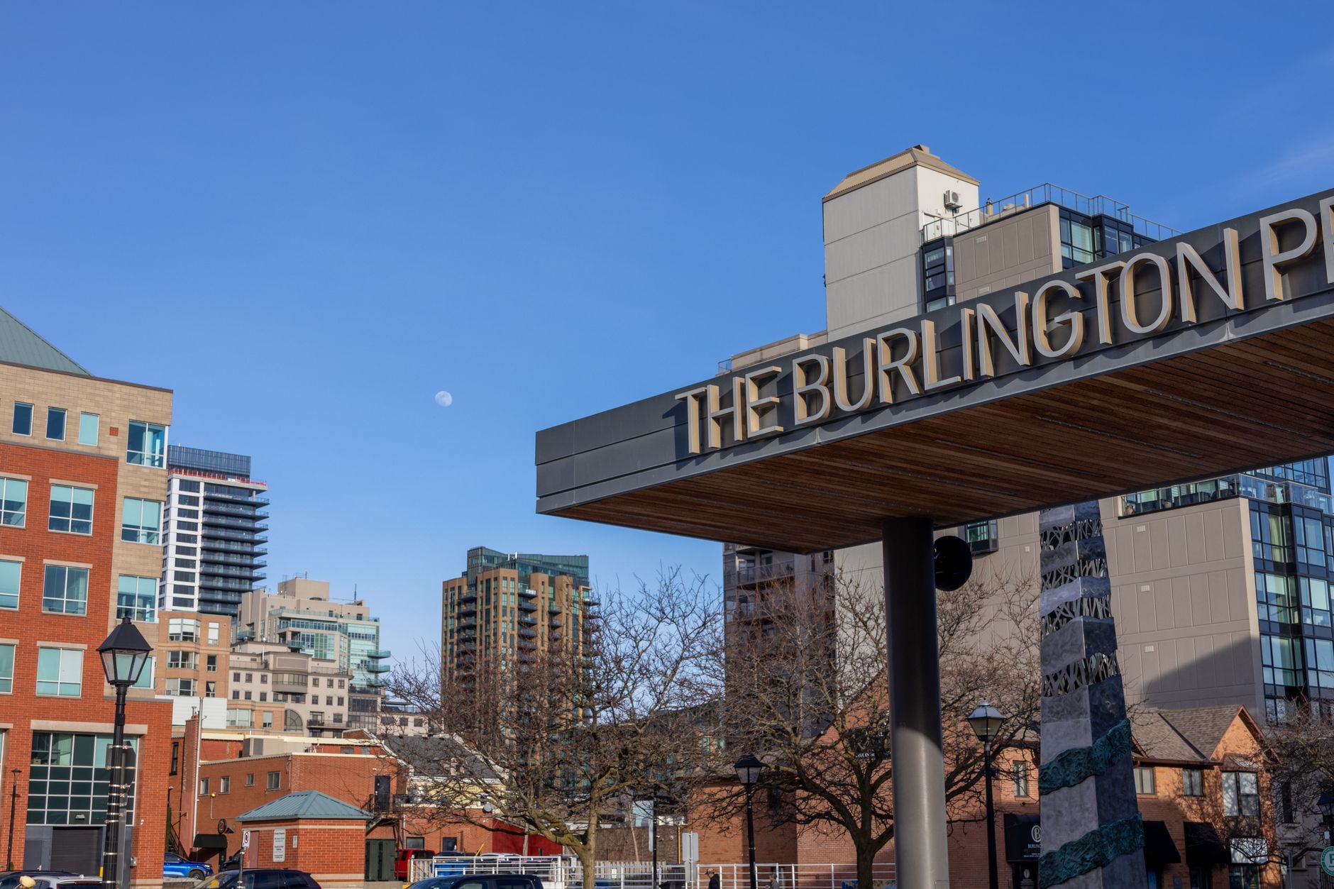 View of city skyline with visible Burlington sign, day time.