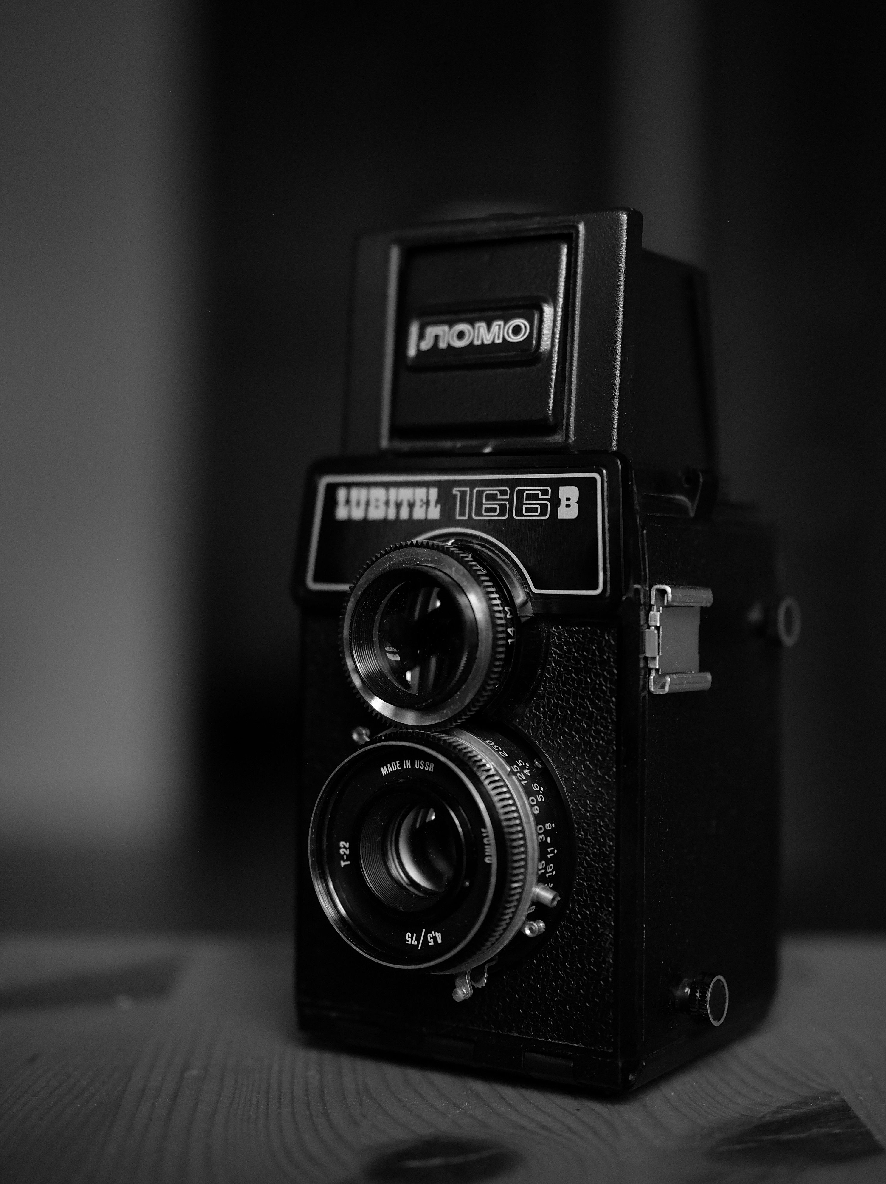 Black and white image of a classic Lubitel 166B twin-lens reflex camera, highlighting vintage design.