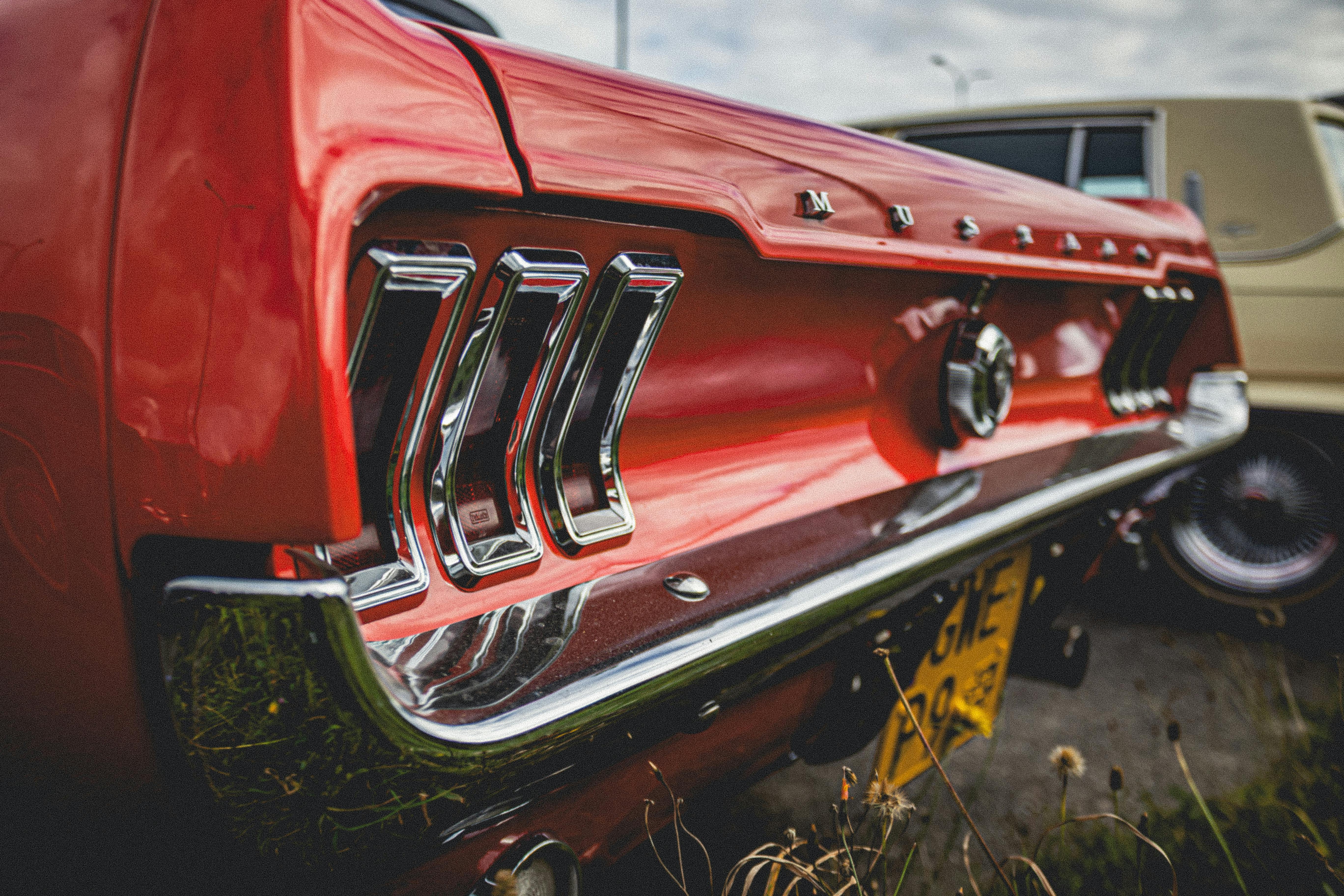 Close-up view of a classic red Ford Mustang