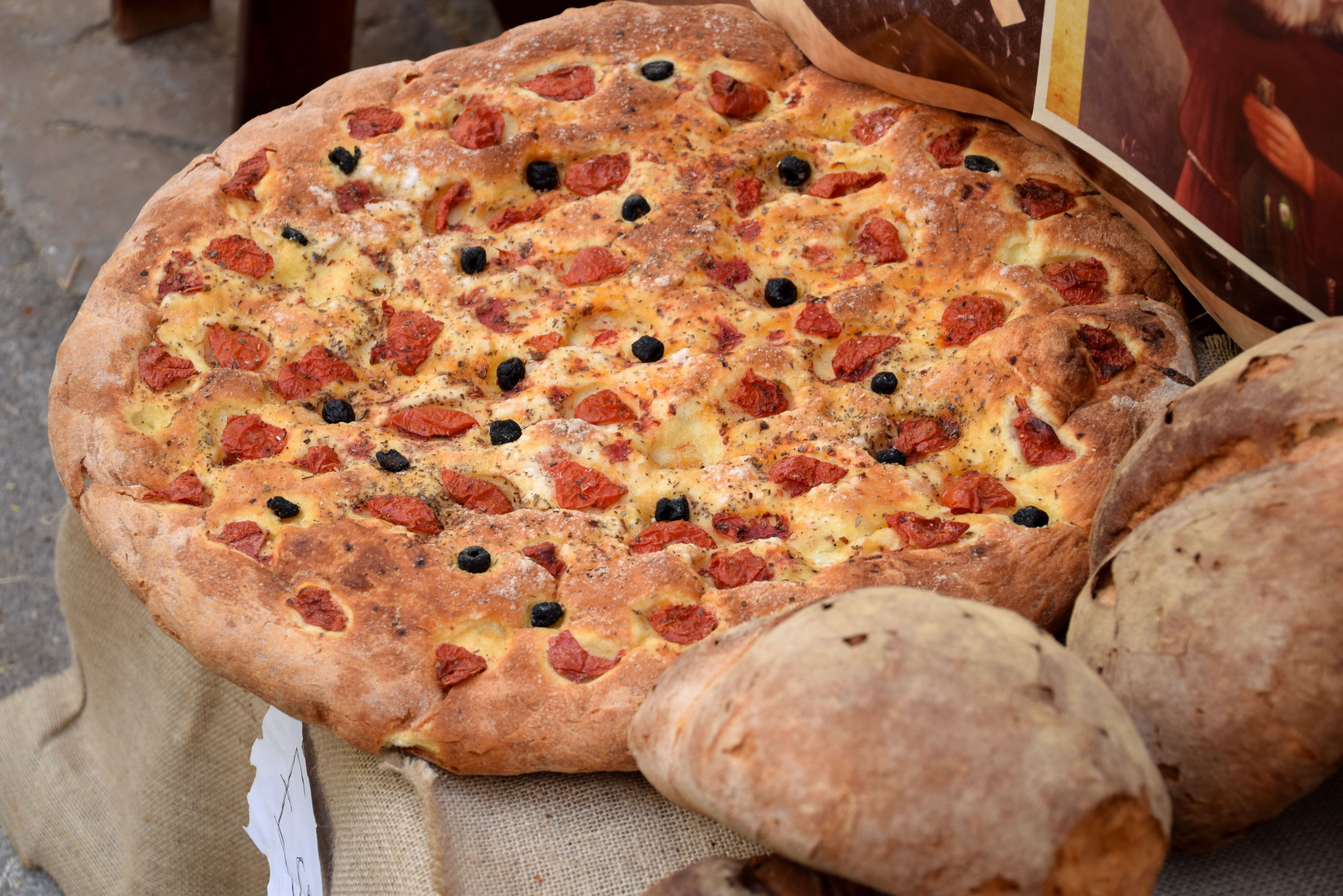 Traditional Italian Focaccia with Olives and Tomatoes · Free Stock Photo