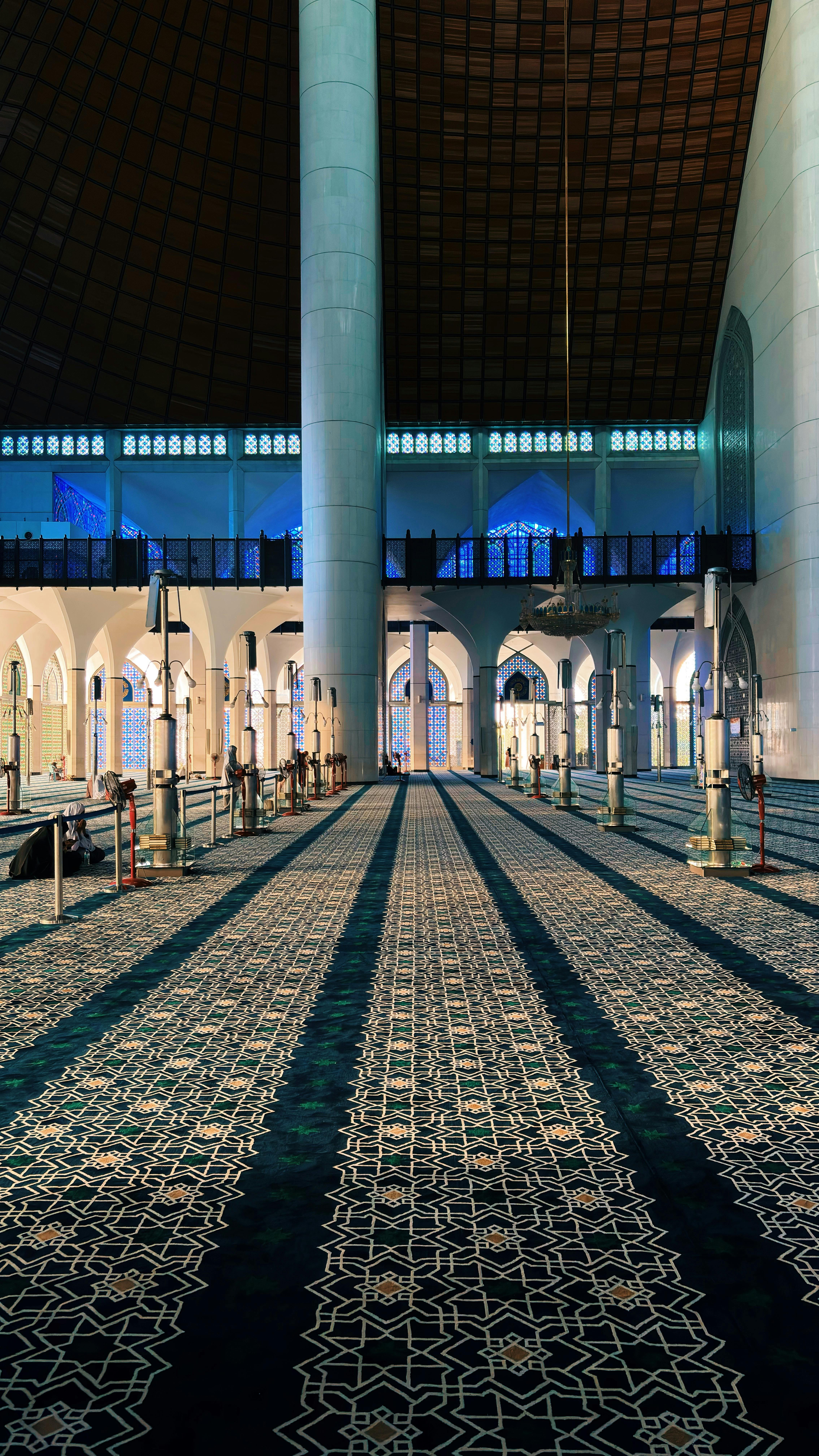 Majestic view of Masjid Sultan Salahuddin Abdul Aziz Shah's intricate interior architecture in Shah Alam, Malaysia.