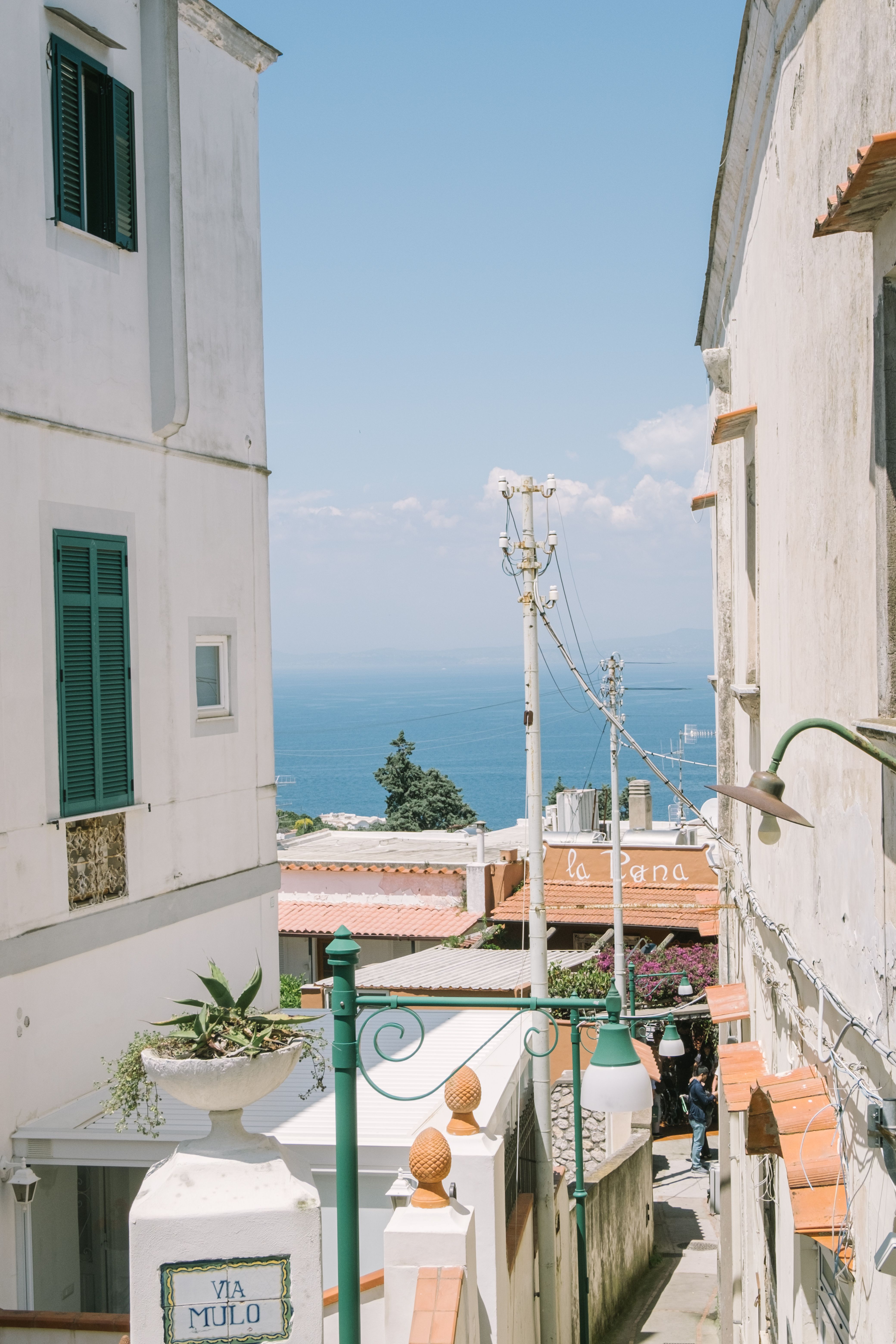 A charming Capri alleyway with a sea view
