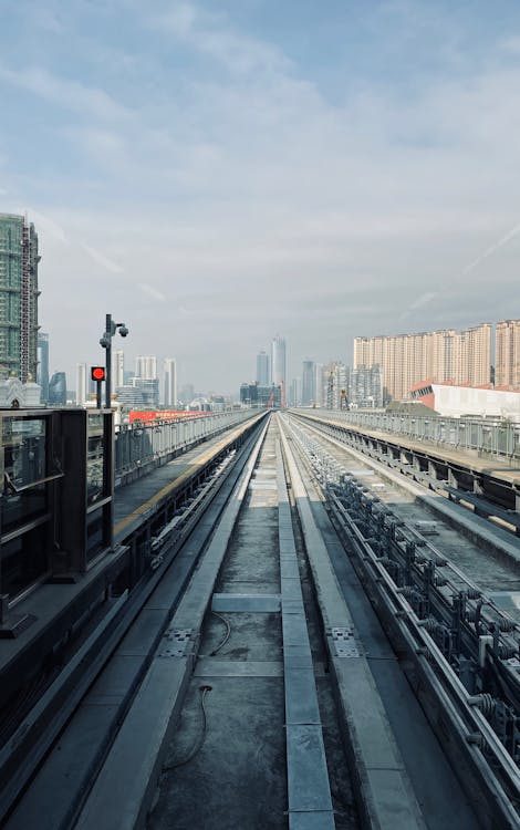 Free Gray Train Railway Across The City  Stock Photo