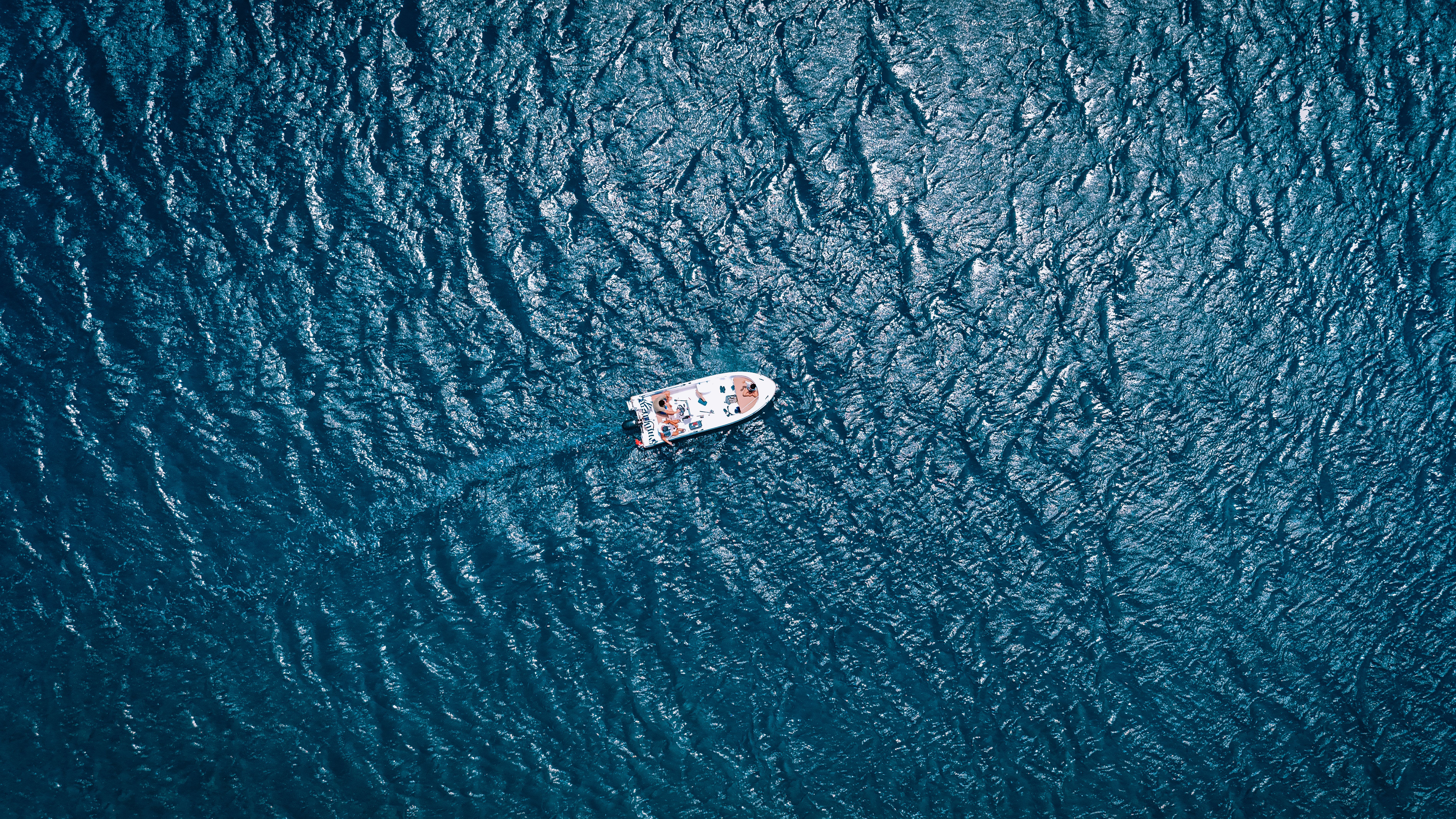 Aerial View of Boat on Vibrant Blue Ocean in Türkiye · Free Stock Photo