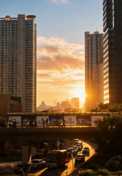 Silhouette of Shanghai skyline with sunset hues reflecting on the modern urban landscape.
