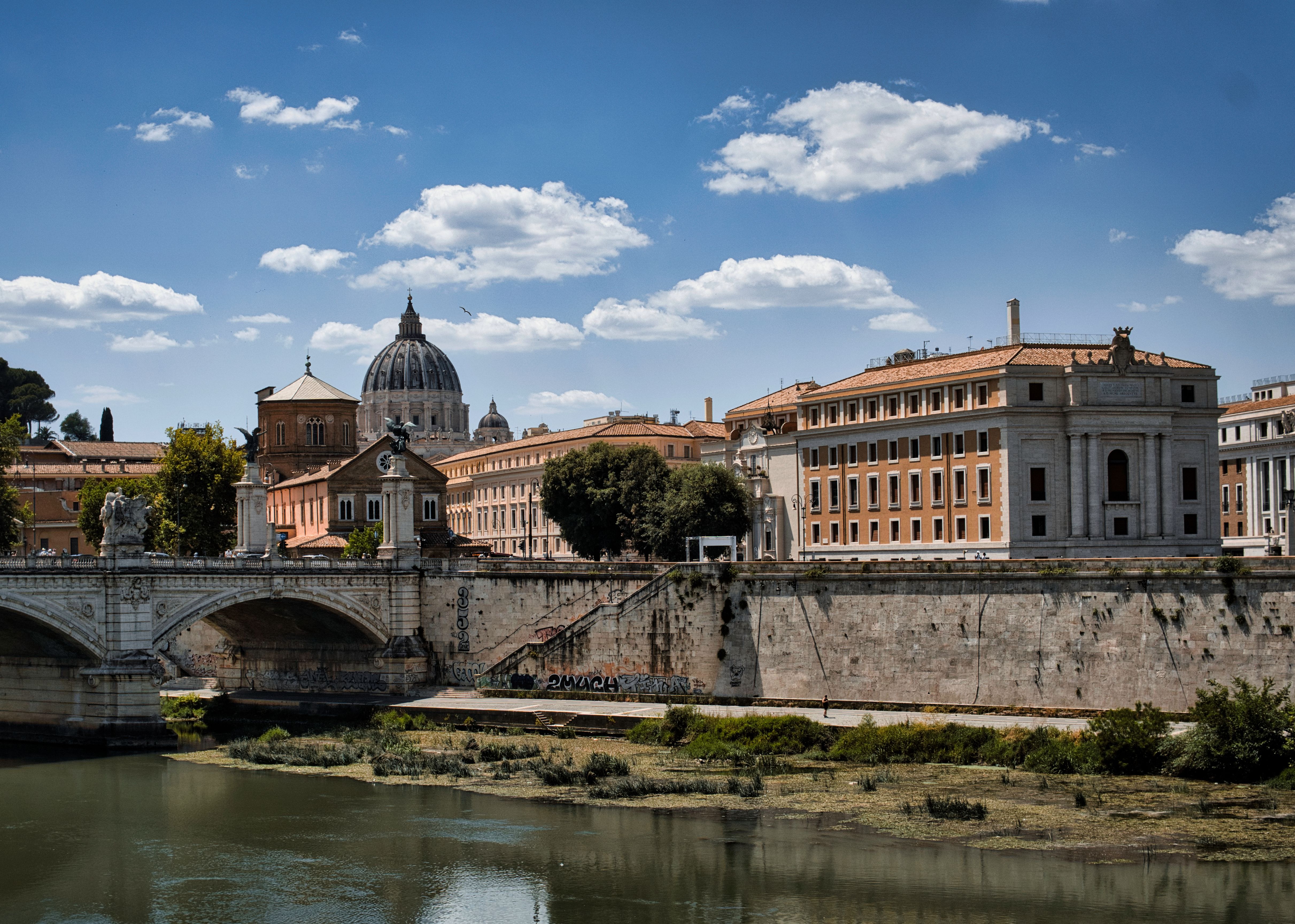 Scenic View of Rome's Historic Architecture and Bridge · Free Stock Photo