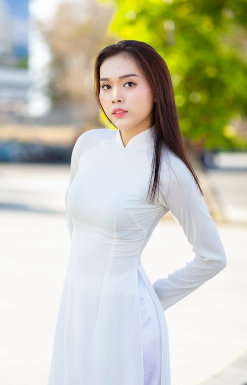 Woman Wearing White Long Sleeve Dress