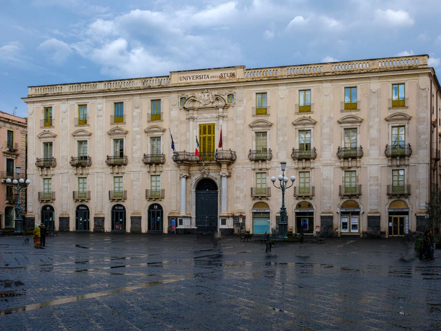 View of the historic university building in Catania, Sicily, showcasing neoclassical architecture.