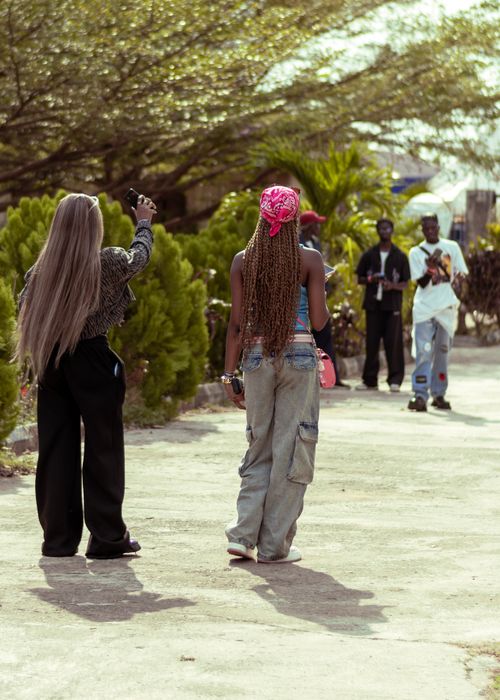 Free Young adults enjoy a sunny day outdoors in Ado Ekiti, Nigeria. Stock Photo