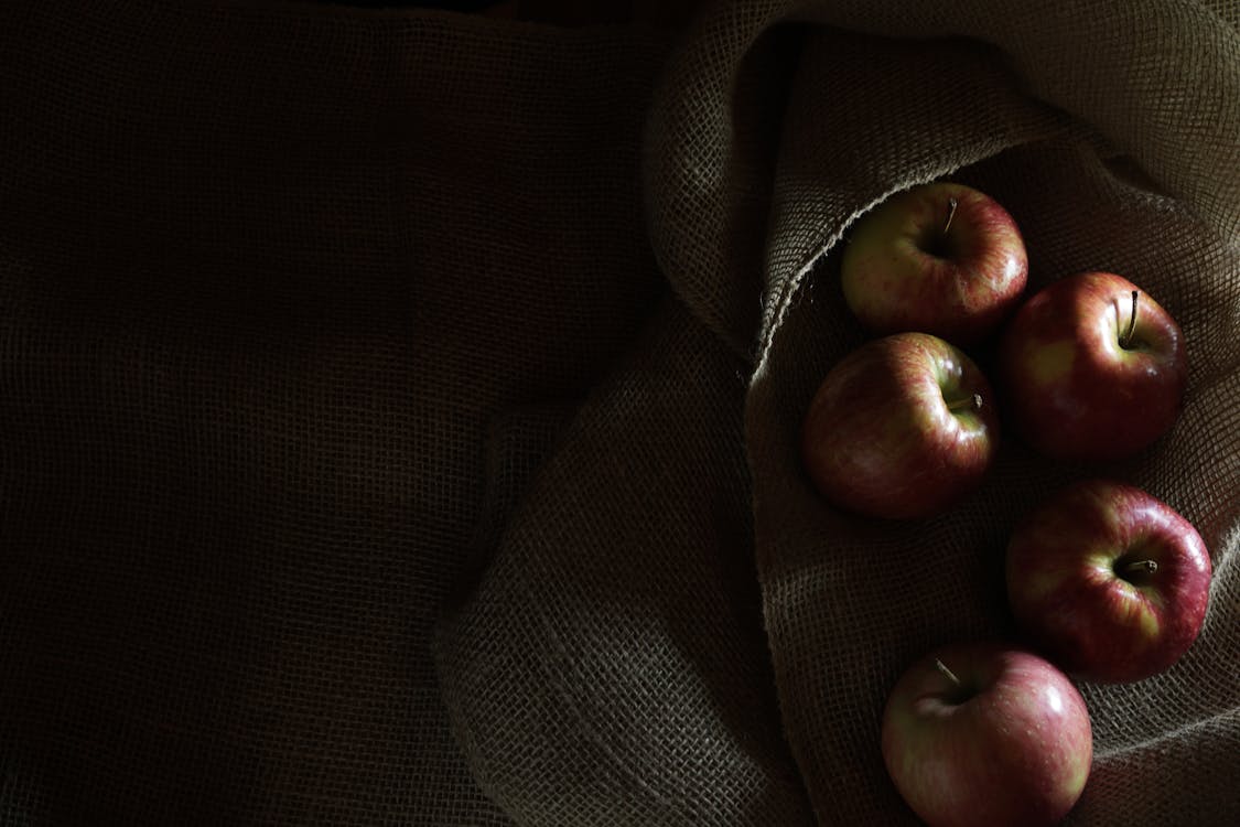 Red Apples on top of Textile