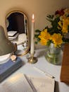 Cozy Desk with Candle and Yellow Flowers
